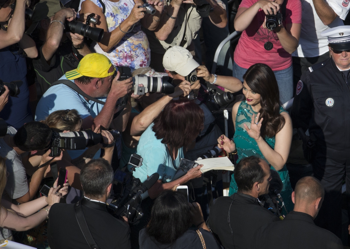 Actress Aishwarya Rai Bachchan waves to cinema fans as she arrives for the screening of the film Aishwarya Rai Bachchan