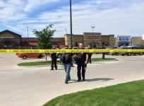 Police escort a man at the scene of a shooting in Waco, Texas, in this handout photo provided by the Waco Police Department on May 17, 2015.