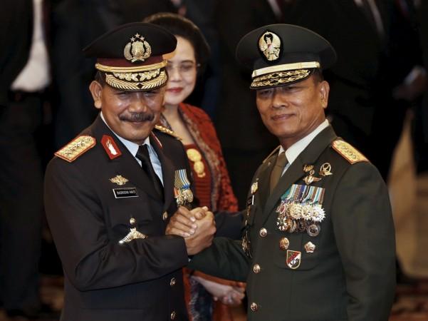 The head of Indonesia's Armed Forces General Moeldoko (right) congratulates the country's new National Police Chief Badrodin Haiti, last month. Moeldoko recently defended the Indonesian military's use of virginity tests for female recruits.