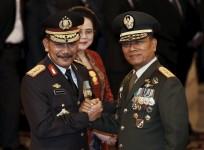 The head of Indonesia's Armed Forces General Moeldoko (right) congratulates the country's new National Police Chief Badrodin Haiti, last month. Moeldoko recently defended the Indonesian military's use of virginity tests for female recruits.