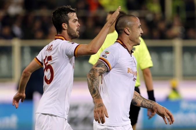 AS Roma's Radja Nainggolan (R) celebrates with his teammate Miralem Pjanic after scoring during his side's Serie A clash against Fiorentina Roma midfielders Miralem Pjanic and Radja Nainggolan