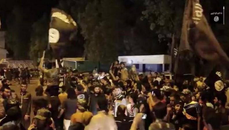A video grab shows Isis supporters in Mosul celebrating the fall of Ramadi.
