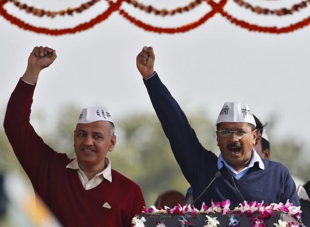Arvind Kejriwal (R), chief of Aam Aadmi (Common Man) Party (AAP),