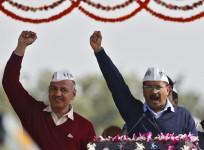Arvind Kejriwal (R), chief of Aam Aadmi (Common Man) Party (AAP),