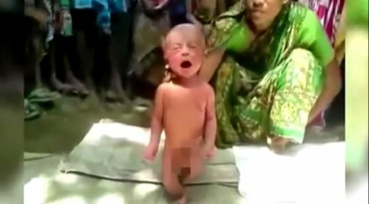 A witch doctor forces a 2-day-old baby to walk in Assam A witch doctor forces a 2-day-old baby to walk in Assam