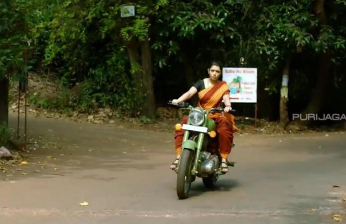 Charmme Kaur is seen riding bullet in Sari in Jyothi Lakshmi Charmme Kaur in Jyothi Lakshmi