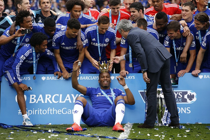 Chelsea's Didier Drogba celebrates with manager Jose Mourinho and team mates after winning the Barclays Premier League Chelsea vs Sunderland