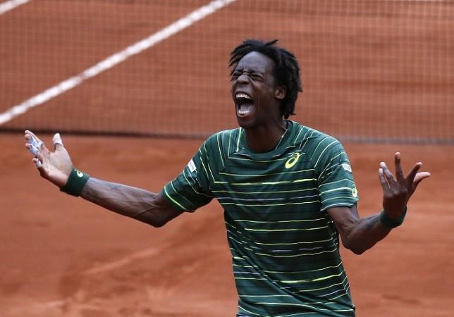 Gael Monfils celebrates after winning a five-setter over Pablo Cuevas in the French Open third round Gael Monfils French Open 2015 3rd Round