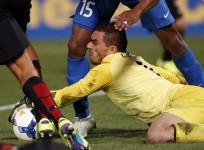 Western Sydney Wanderers goalkeeper Ante Covic grabs the ball as Nassir Alshamrani of Saudi Arabia's Al-Hilal runs into him during their Asian Champions League final first-leg football match at Parramatta Stadium in Sydney on 31 October, 2014
