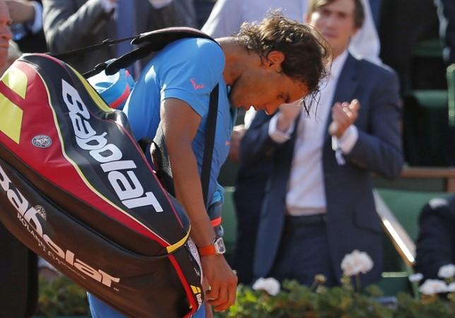 Rafael Nadal walks off the court after a straight-set defeat to Novak Djokovic in the French Open quarterfinals Rafael Nadal French Open 2015 Quarterfinal
