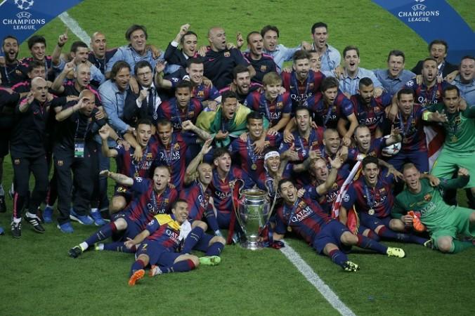Barcelona players with the Champions League trophy Barcelona Champions League Title Trophy
