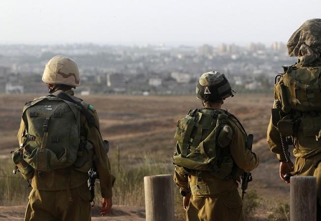 Israeli soldiers patrol near the border with the Gaza Strip.