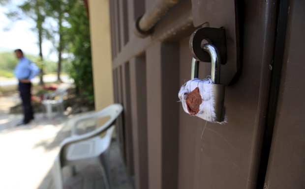 A sealed lock is seen at the gate of Save the Children charity's office in Islamabad