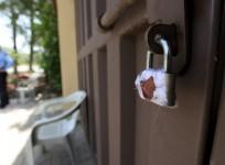 A sealed lock is seen at the gate of Save the Children charity's office in Islamabad