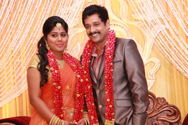 Vidharth and Gayathri Devi posing for camera at their wedding reception. Vidharth-Gayathri Devi Wedding Reception
