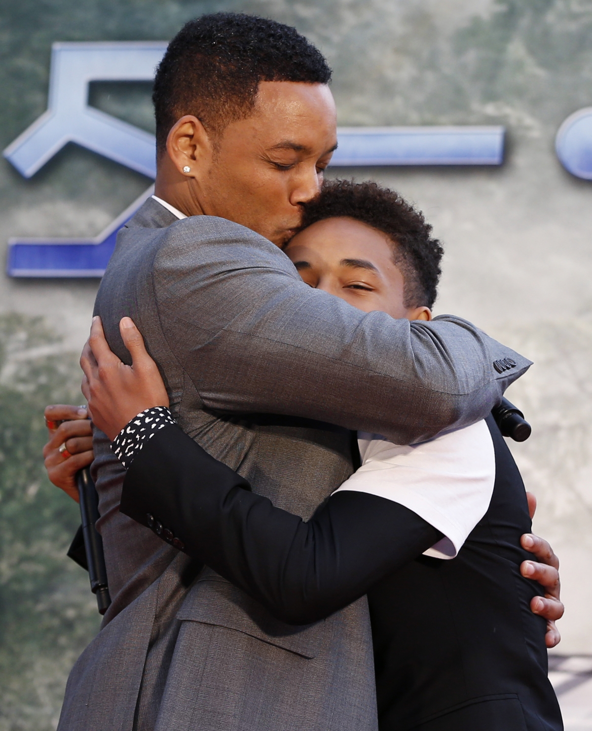 Will Smith hugs his son