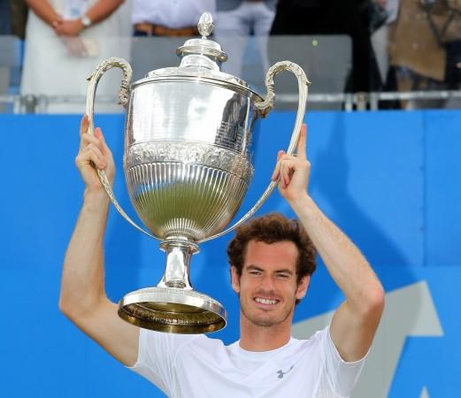 Andy Murray lifts aloft the trophy after winning the Aegon Championship. Andy Murray