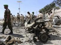 Somalia's army soldiers and peacekeepers from the African Union Mission in Somalia (AMISOM) gather at the scene of an explosion in front of the airport in Somalia's capital Mogadishu, December 3, 2014.