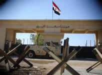 An Egyptian soldier keeps watch at the closed Rafah border crossing, between southern Gaza Strip