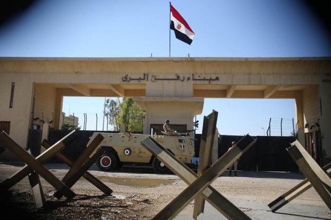 An Egyptian soldier keeps watch at the closed Rafah border crossing, between southern Gaza Strip
