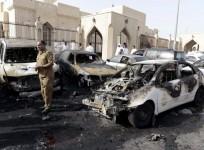 A policeman inspects the site of a car bomb near the Shi'ite al-Anoud mosque in Saudi Arabia's city Dammam