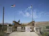Israel will build a 30 km fence along its border with Jordan to seal-off the country from any attacks by Isis. File image shows Israeli and Jordanian flag on a border between the two countries.