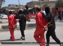 A file image shows Isis fighters taking Iraqi men condemned to be killed on charges of spying for the government.