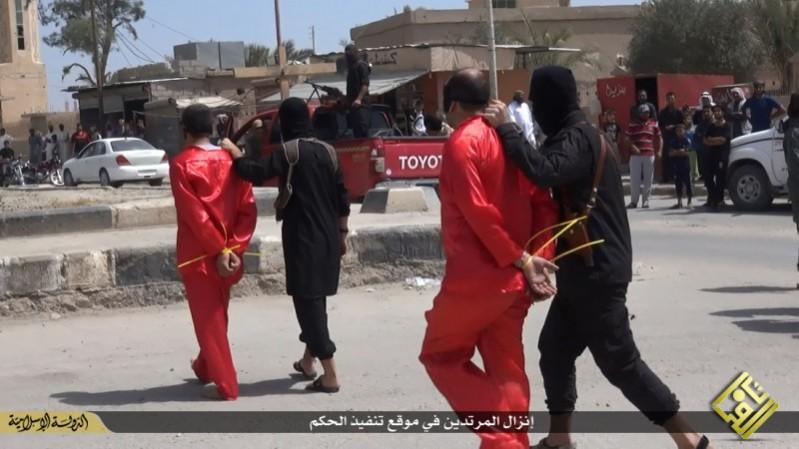 A file image shows Isis fighters taking Iraqi men for execution after its Sharia court condemned them to be killed on charges of spying for the government. A file image shows Isis fighters taking Iraqi men condemned to be killed on charges of spying for the government.