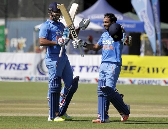 Kedar Jadhav celebrates his first ever ODI century as Stuart Binny applauds Stuart Binny Kedar Kadhav India