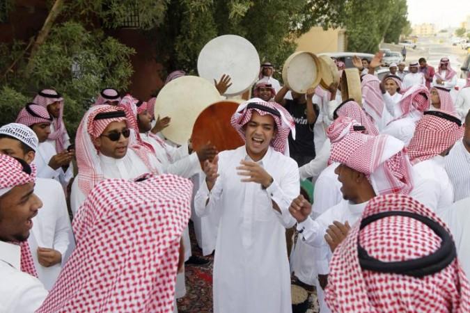 Saudi youth dance as they celebrate Eid al-Fitr in Riyadh in 2012