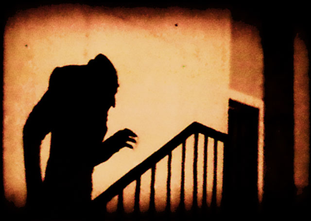 An iconic scene of the shadow of Count Orlok climbing up a staircase An iconic scene of the shadow of Count Orlok climbing up a staircase