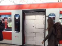 masked-pranksters-build-wall-on-train-carriage-to-stop-passengers-entering