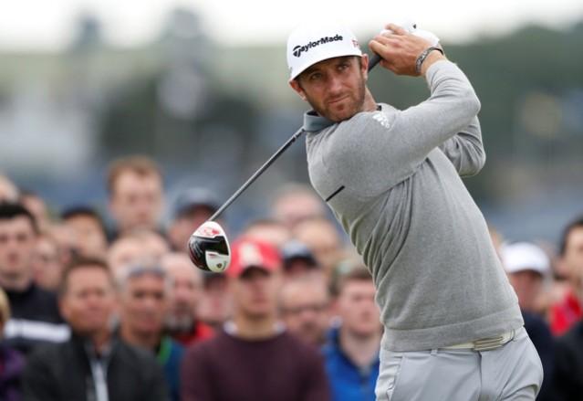 Dustin Johnson of the US watches his tee shot on the fourth hole during the first round of the British Open dustin johnson