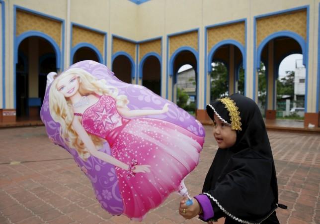 A girl plays at the Blue Mosque in Taguig, Metro Manila in Philippines. Eid al-Fitr 2015