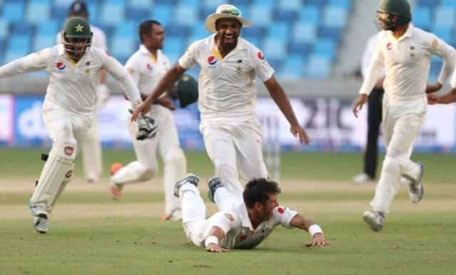 Pakistan's Yasir Shah celebrates taking the final wicket of England's Adil Rashid in their second test at Dubai pakistan cricket