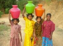 girls carrying water