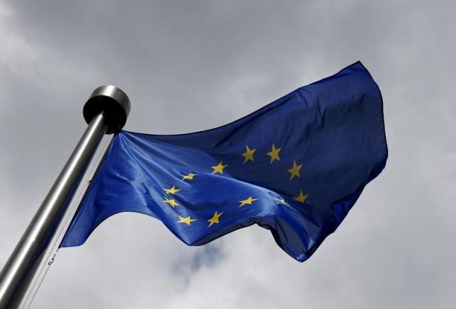 An European Union flag flutters outside the European Commission headquarters in Brussels, Belgium, June