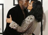 Kim Kardashian and Kanye West kissing and hugging each other at the 57th annual Grammy Awards in Los Angeles.
