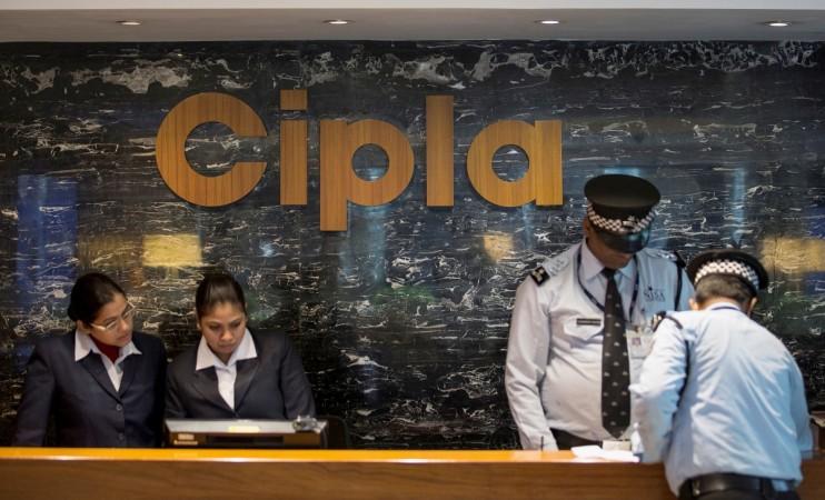 Employees and security staff work at the reception area of Cipla at its headquarters in Mumbai on June 17, 2015. Cipla ltd.