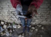Man holds a mobile phone charger