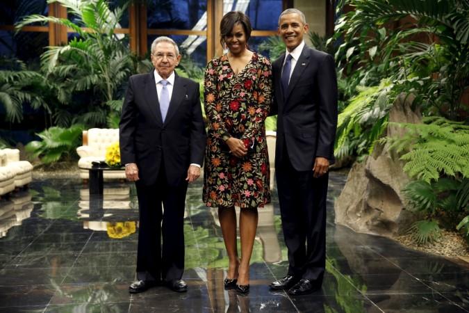 Cuban President Raul Castro greets U.S. President Barack Obama and first lady Michelle Obama