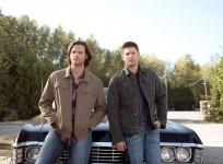 Sam and Dean in front of the Impala