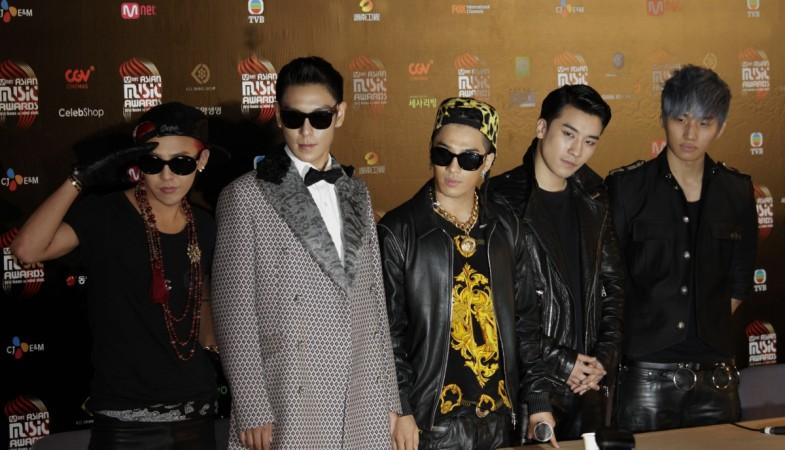 Members from South Korean pop group Big Bang pose backstage after winning Artist of the Year Award in the 2012 Mnet Asian Music Awards