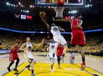 Golden State Warriors guard Ian Clark (21) goes up for a layup against Houston Rockets forward Trevor Ariza
