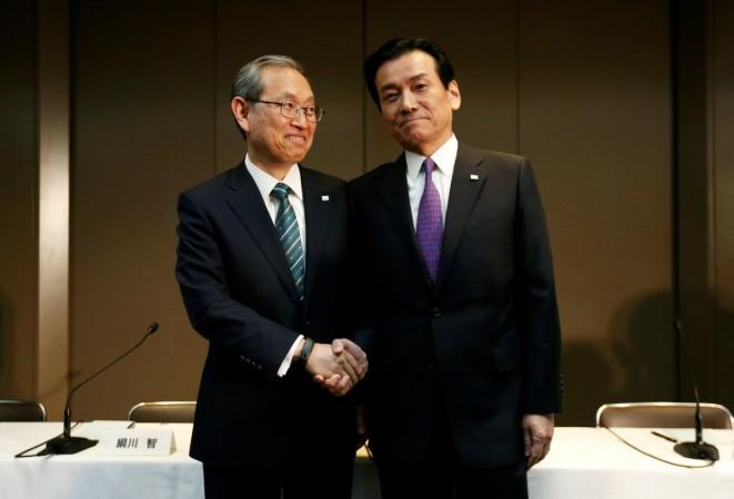 Toshiba Corp incoming President and chief executive Satoshi Tsunakawa (L) and incoming chairman Shigenori Shiga during a news conference at the company headquarters in Tokyo, Japan