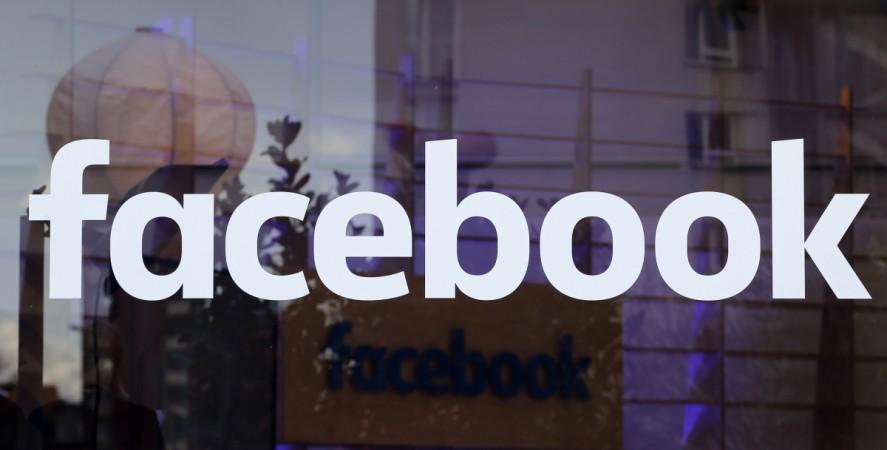 The logo of Facebook is pictured on a window at new Facebook Innovation Hub