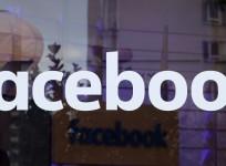 The logo of Facebook is pictured on a window at new Facebook Innovation Hub