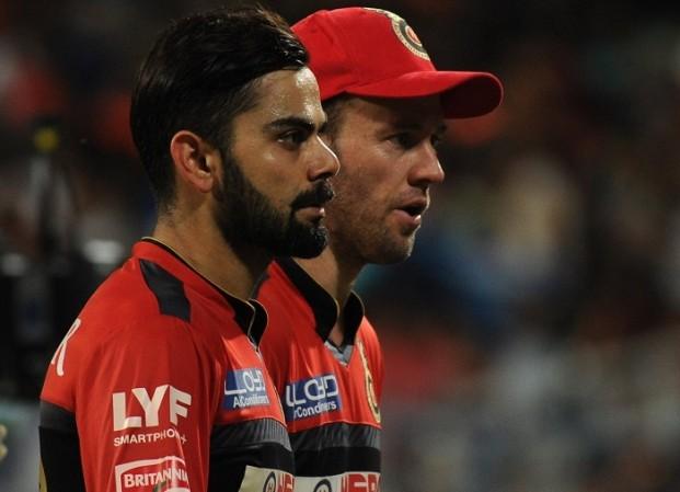 RCB team-mates Virat Kohli (left) and AB de Villiers during IPL. Virat Kohli AB De Villiers RCB