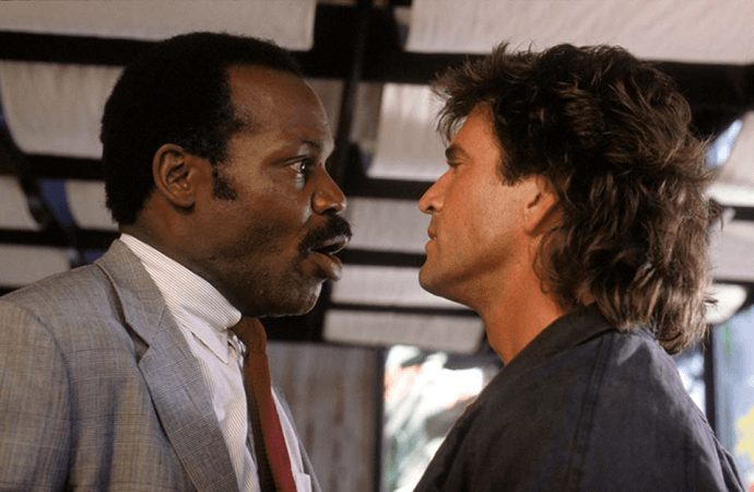 Danny Glover and Mel Gibson as Roger Murtaugh and Martin Riggs