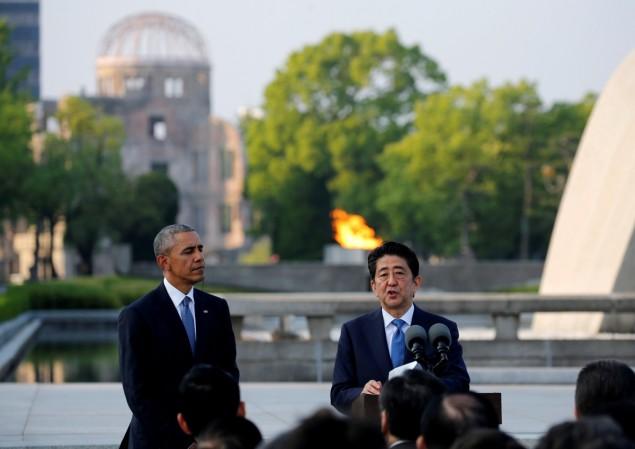 U.S. President Barack Obama (L) and Japanese Prime Minister Shinzo Abe deliver speeches in front of the atomic bomb dome after they laid wreaths to a cenotaph at Hiroshima Peace Memorial Park in Hiroshima, Japan May 27, 2016. Obama at Hiroshima